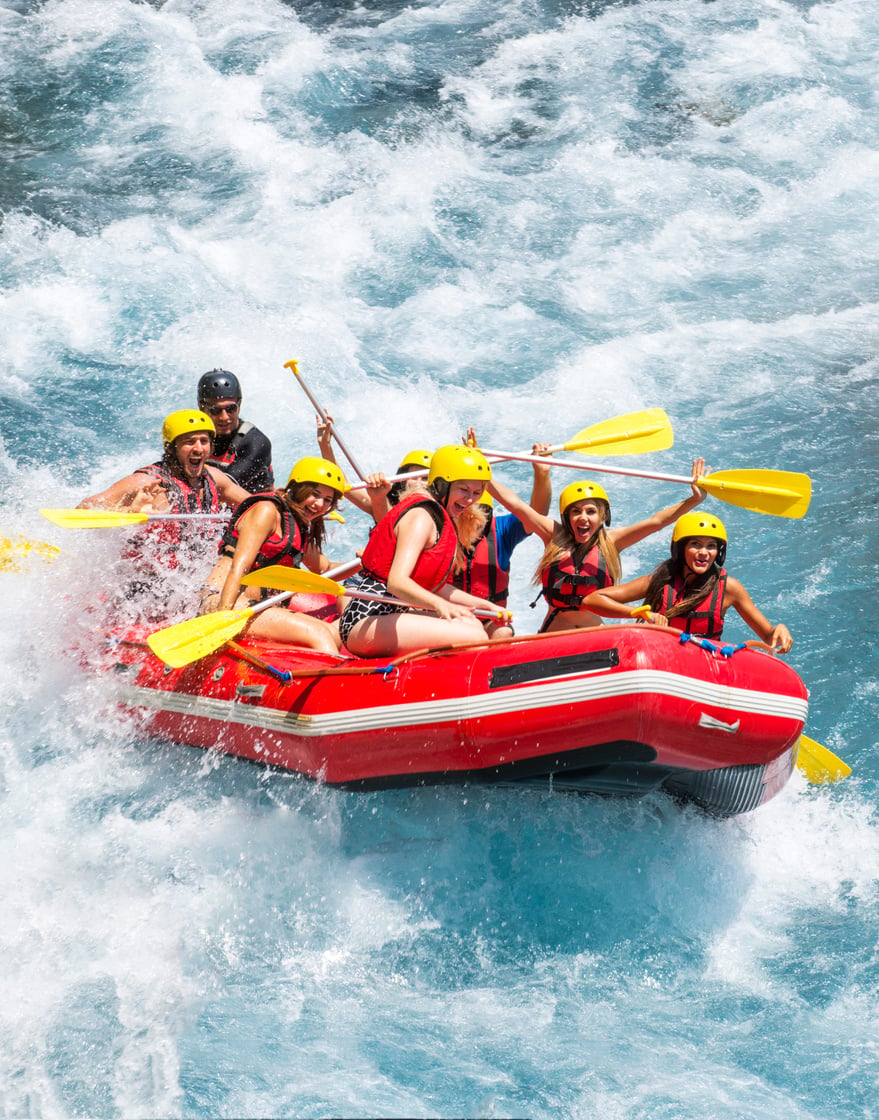 Group of people white water rafting